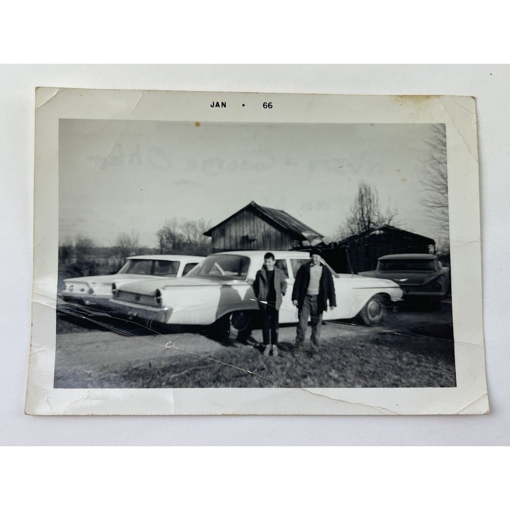 Vintage Black and White Picture of 2 Boys Standing w/ Old Cars And a Barn 1966